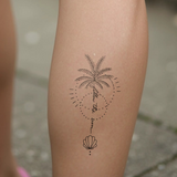 volg de zon palmboom Tatoeage