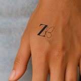 Vlinder met initialen tatoeage (A-Z)