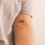 Liggende Panda Tatoeage