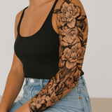 Leeuw in bloemenzee Tattoo Sleeve